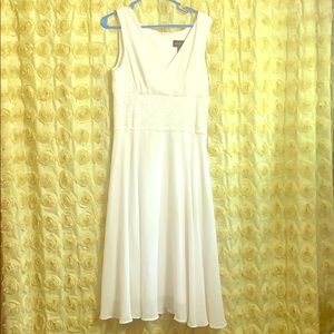 white dress. Hem damage otherwise great condition
